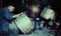 Metal worker in Old Market of Fez